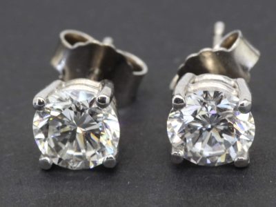 Diamond stud earrings in silver settings for women.