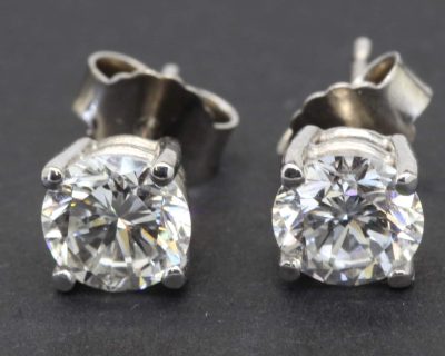 Diamond stud earrings in silver settings for women.