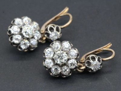 Elegant diamond cluster earrings with sparkling stones, perfect for special occasions and jewelry lo.