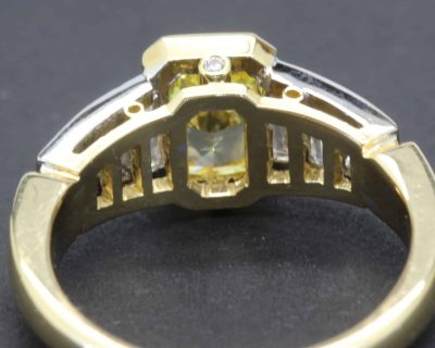 Elegant gold and diamond ring with a central gemstone, crafted by Weldons Jewellers. Perfect for spe.