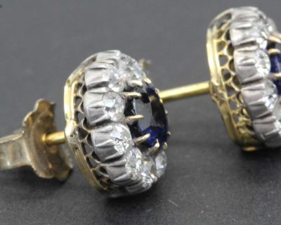 Gold and silver earrings with sapphires and diamonds for women.