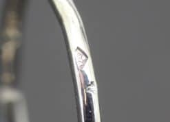 Elegant Cartier diamond ring with signature hallmark.