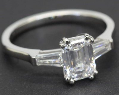 Silver ring with a large emerald-cut diamond gemstone for women.