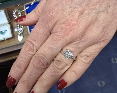 Diamond engagement ring on a woman's finger showcasing fine jewelry.