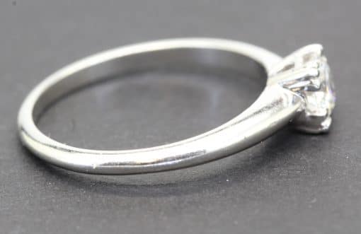 Engagement ring with a sparkling diamond set in a silver band, crafted by Weldons Jewellers.
