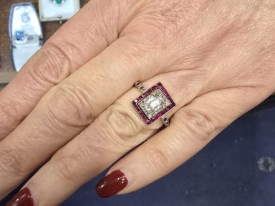 Diamond and ruby engagement ring with a square design, crafted by Weldons Jewellers.