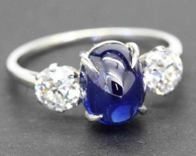 Elegant blue sapphire and diamond ring with a silver band, perfect for special occasions.