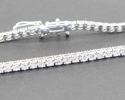 Sparkling diamond tennis bracelet with a secure clasp, perfect for special occasions.