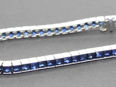 Sapphire tennis bracelet with silver setting, perfect for special occasions.