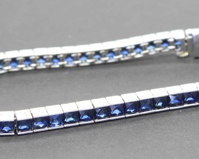Sapphire tennis bracelet with silver setting, perfect for special occasions.