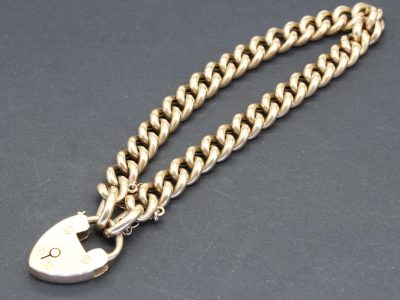 Gold chain with padlock pendant, perfect for jewelry lovers and gift buyers.
