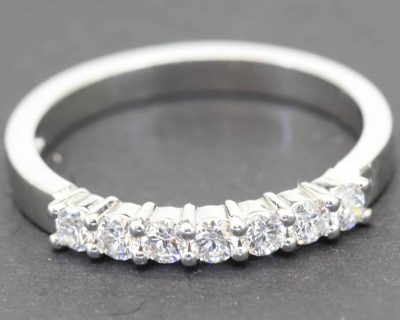 Diamond eternity ring with sparkling stones on a silver band.