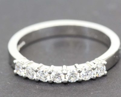 Diamond eternity ring with multiple sparkling stones.