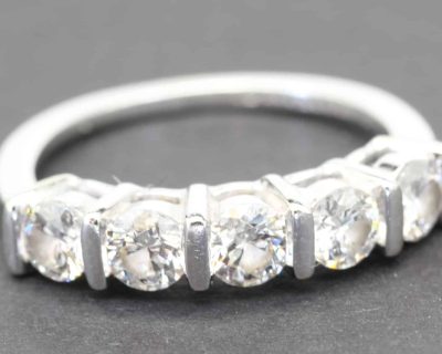 Stunning diamond eternity ring with sparkling stones in a silver band.