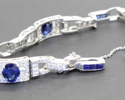Beautiful silver bracelet featuring blue sapphires and sparkling diamonds. Perfect for special occas.