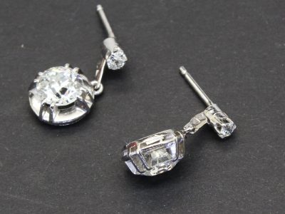 Diamond drop earrings with sparkling gemstones and silver settings.