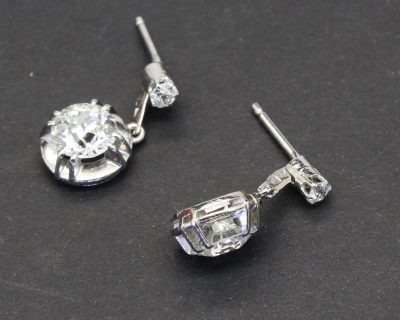 Diamond drop earrings with sparkling gemstones and silver settings.