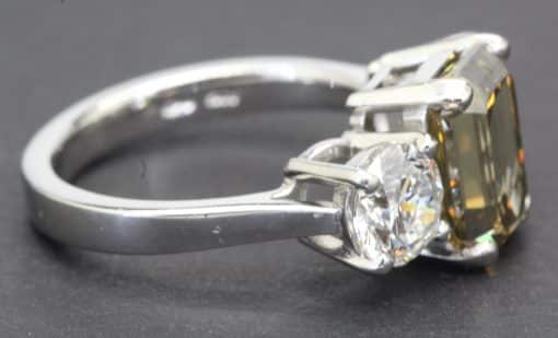 Elegant diamond and topaz ring with a sleek silver band, perfect for engagement or special occasions.