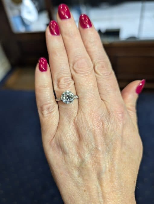 Antique diamond Cartier ring on a hand