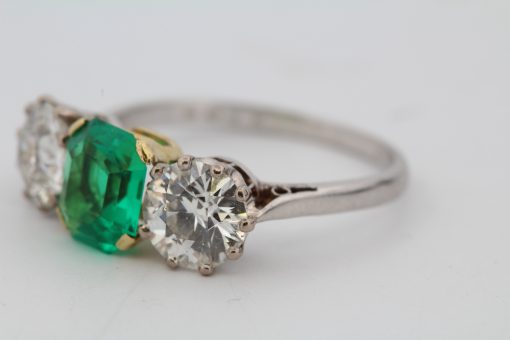 Colombian emerald and diamond three stone ring, side view