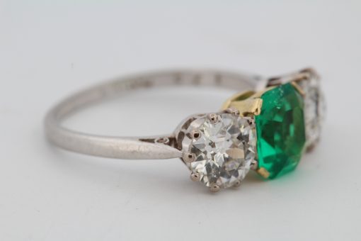 Colombian emerald and diamond three stone ring, side view