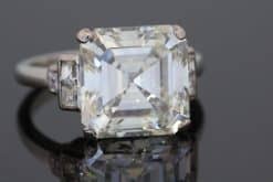 The Story & History An exceptional antique diamond ring centred by an impressive 6.7-carat diamond, mounted in platinum and framed by diamond-set shoulders. The scale of the principal stone gives the ring an unmistakable presence, while the platinum setting provides the refined, enduring foundation expected of a jewel of this calibre. The diamond is accompanied by a GIA certificate, documenting a J colour and VS clarity. Its substantial carat weight and classic solitaire-inspired composition make this a particularly striking piece for the serious diamond collector. Design & Details The 6.7-carat centre diamond is beautifully presented within a platinum mount, with graduated diamond-set shoulders adding brilliance and visual continuity to the design. Platinum is particularly well suited to a substantial diamond ring, providing strength and a naturally understated white-metal setting that allows the principal stone to remain the focus. The combination of a very large centre diamond, platinum construction and diamond shoulders creates a classic yet highly impressive silhouette. Styling & Wearability This is a statement diamond ring intended to command attention. The substantial centre stone gives it considerable presence on the hand, while the diamond shoulders provide additional sparkle without distracting from the principal diamond. Its classic proportions allow it to be worn as an exceptional engagement ring or simply as a significant diamond jewel for an established collection.