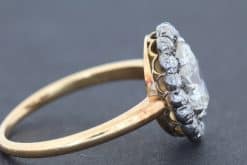 An extremely rare antique Irish cluster ring, combining the distinctive character of antique Irish jewellery with the enduring elegance of the classic diamond cluster. The ring is presented in its original Wests box, adding an especially appealing period detail to this exceptional jewel.
