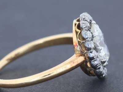 An extremely rare antique Irish cluster ring, combining the distinctive character of antique Irish jewellery with the enduring elegance of the classic diamond cluster. The ring is presented in its original Wests box, adding an especially appealing period detail to this exceptional jewel.