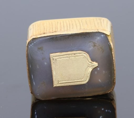 Antique musical fob, base view