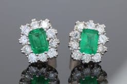 A beautiful pair of Colombian emerald and diamond cluster earrings, set in 18kt white gold. With a combined emerald weight of 1.88 carats, the earrings showcase the rich, unmistakable colour for which Colombian emeralds are so highly prized. The classic cluster arrangement gives these earrings an elegant presence while allowing the emeralds to remain the focal point. The combination of vivid green gemstones and brilliant diamonds creates a timeless pairing suited to both collectors and lovers of fine coloured-stone jewellery.
