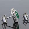 A beautiful pair of Colombian emerald and diamond cluster earrings, set in 18kt white gold. With a combined emerald weight of 1.88 carats, the earrings showcase the rich, unmistakable colour for which Colombian emeralds are so highly prized. The classic cluster arrangement gives these earrings an elegant presence while allowing the emeralds to remain the focal point. The combination of vivid green gemstones and brilliant diamonds creates a timeless pairing suited to both collectors and lovers of fine coloured-stone jewellery.