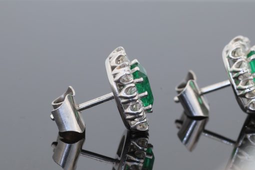 A beautiful pair of Colombian emerald and diamond cluster earrings, set in 18kt white gold. With a combined emerald weight of 1.88 carats, the earrings showcase the rich, unmistakable colour for which Colombian emeralds are so highly prized. The classic cluster arrangement gives these earrings an elegant presence while allowing the emeralds to remain the focal point. The combination of vivid green gemstones and brilliant diamonds creates a timeless pairing suited to both collectors and lovers of fine coloured-stone jewellery.