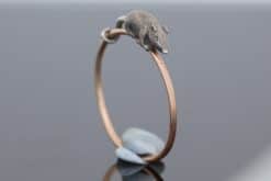 A wonderfully charming Victorian novelty ring by Thornhill & Co., featuring a delightful little mouse in silver. Victorian jewellers were particularly celebrated for their imaginative and whimsical jewels, transforming familiar creatures and objects into highly inventive pieces of wearable art. This unusual ring captures that playful spirit beautifully. Rather than being fixed in place, the little mouse is free-running on the shank, allowing him to spin around the finger. This ingenious feature gives the jewel an engaging sense of movement and makes it an especially memorable example of Victorian novelty jewellery.
