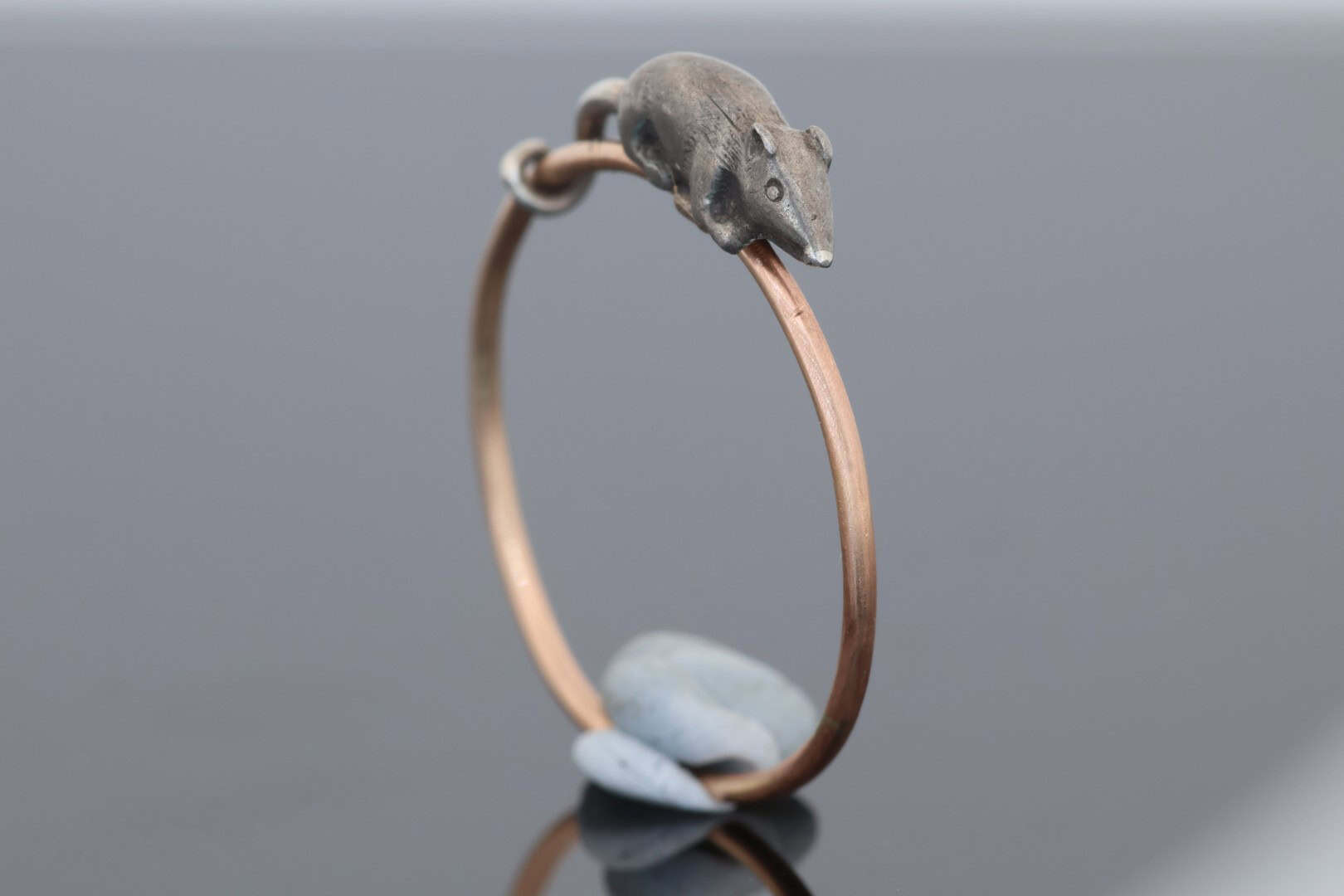 A wonderfully charming Victorian novelty ring by Thornhill & Co., featuring a delightful little mouse in silver. Victorian jewellers were particularly celebrated for their imaginative and whimsical jewels, transforming familiar creatures and objects into highly inventive pieces of wearable art. This unusual ring captures that playful spirit beautifully. Rather than being fixed in place, the little mouse is free-running on the shank, allowing him to spin around the finger. This ingenious feature gives the jewel an engaging sense of movement and makes it an especially memorable example of Victorian novelty jewellery.
