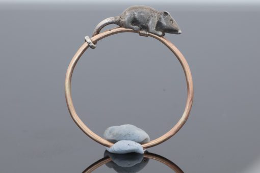 A wonderfully charming Victorian novelty ring by Thornhill & Co., featuring a delightful little mouse in silver. Victorian jewellers were particularly celebrated for their imaginative and whimsical jewels, transforming familiar creatures and objects into highly inventive pieces of wearable art. This unusual ring captures that playful spirit beautifully. Rather than being fixed in place, the little mouse is free-running on the shank, allowing him to spin around the finger. This ingenious feature gives the jewel an engaging sense of movement and makes it an especially memorable example of Victorian novelty jewellery.
