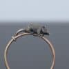 A wonderfully charming Victorian novelty ring by Thornhill & Co., featuring a delightful little mouse in silver. Victorian jewellers were particularly celebrated for their imaginative and whimsical jewels, transforming familiar creatures and objects into highly inventive pieces of wearable art. This unusual ring captures that playful spirit beautifully. Rather than being fixed in place, the little mouse is free-running on the shank, allowing him to spin around the finger. This ingenious feature gives the jewel an engaging sense of movement and makes it an especially memorable example of Victorian novelty jewellery.