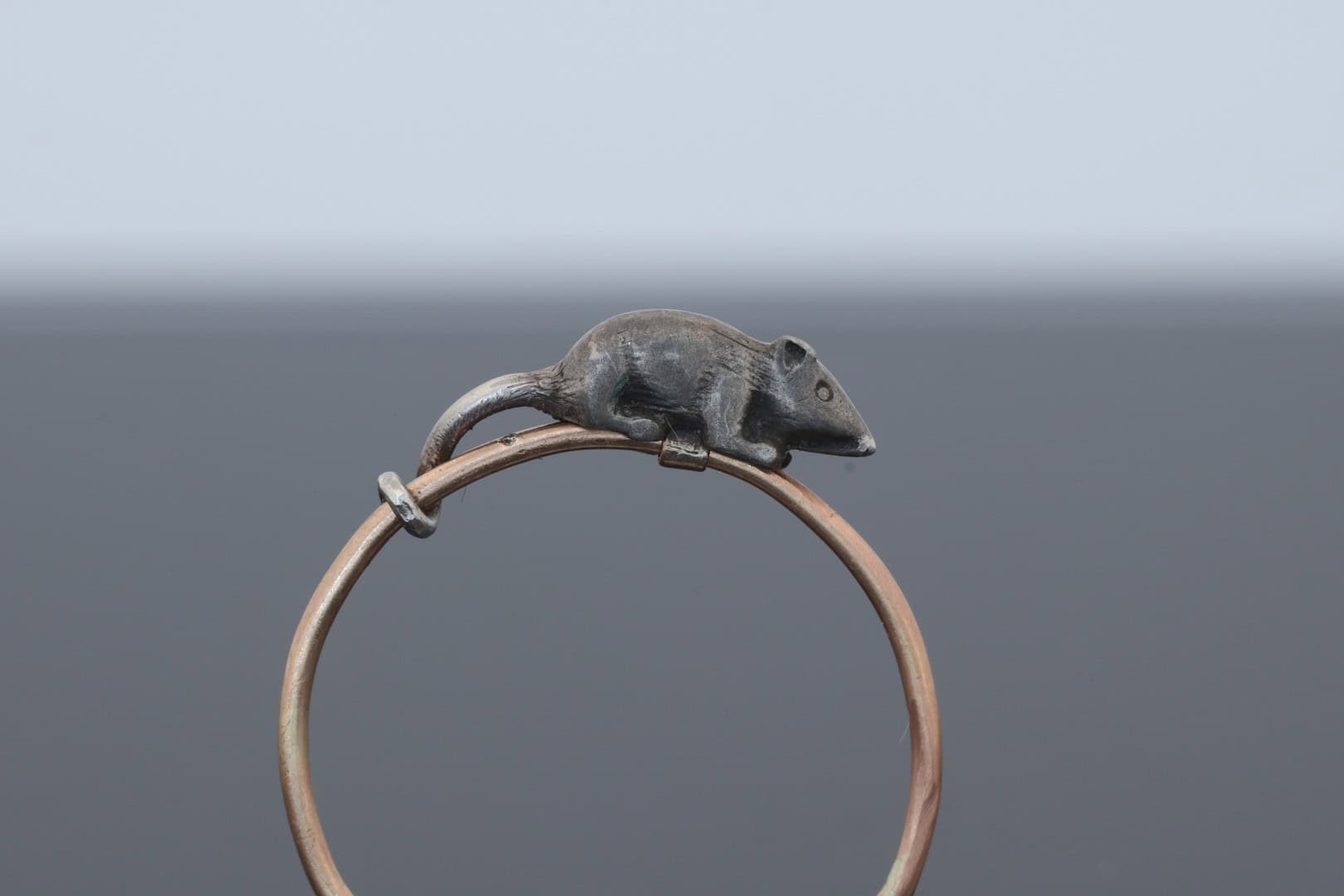 A wonderfully charming Victorian novelty ring by Thornhill & Co., featuring a delightful little mouse in silver. Victorian jewellers were particularly celebrated for their imaginative and whimsical jewels, transforming familiar creatures and objects into highly inventive pieces of wearable art. This unusual ring captures that playful spirit beautifully. Rather than being fixed in place, the little mouse is free-running on the shank, allowing him to spin around the finger. This ingenious feature gives the jewel an engaging sense of movement and makes it an especially memorable example of Victorian novelty jewellery.
