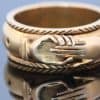 A rare and evocative Georgian “Mane in Fede” memorial ring, made in 1774. The name Mane in Fede refers to the traditional motif of two clasped hands, symbolising faith, fidelity and enduring affection. Memorial rings of this type formed an intimate connection between jewellery and remembrance, often incorporating a lock of the deceased’s hair as a tangible keepsake. This example is particularly intriguing for its ingenious concealed compartment.