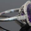 A magnificent 5-carat Siberian amethyst and diamond cluster ring, beautifully presented in platinum. The impressive scale and rich colour of the amethyst make this a particularly striking jewel, with the cool brilliance of the surrounding diamonds creating a refined contrast. Siberian amethyst is prized for its distinctive deep violet colour, and a stone of this substantial size makes a memorable centrepiece for a fine antique or vintage jewellery collection.