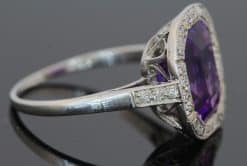 A magnificent 5-carat Siberian amethyst and diamond cluster ring, beautifully presented in platinum. The impressive scale and rich colour of the amethyst make this a particularly striking jewel, with the cool brilliance of the surrounding diamonds creating a refined contrast. Siberian amethyst is prized for its distinctive deep violet colour, and a stone of this substantial size makes a memorable centrepiece for a fine antique or vintage jewellery collection.