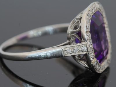 A magnificent 5-carat Siberian amethyst and diamond cluster ring, beautifully presented in platinum. The impressive scale and rich colour of the amethyst make this a particularly striking jewel, with the cool brilliance of the surrounding diamonds creating a refined contrast. Siberian amethyst is prized for its distinctive deep violet colour, and a stone of this substantial size makes a memorable centrepiece for a fine antique or vintage jewellery collection.