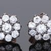 A superb pair of Victorian diamond cluster earrings, showcasing the opulent sparkle and intricate character associated with nineteenth-century jewellery. Together they contain approximately 3 carats of diamonds, creating a wonderfully substantial presence while retaining the elegant proportions of a classic Victorian cluster design.