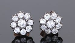 A superb pair of Victorian diamond cluster earrings, showcasing the opulent sparkle and intricate character associated with nineteenth-century jewellery. Together they contain approximately 3 carats of diamonds, creating a wonderfully substantial presence while retaining the elegant proportions of a classic Victorian cluster design.