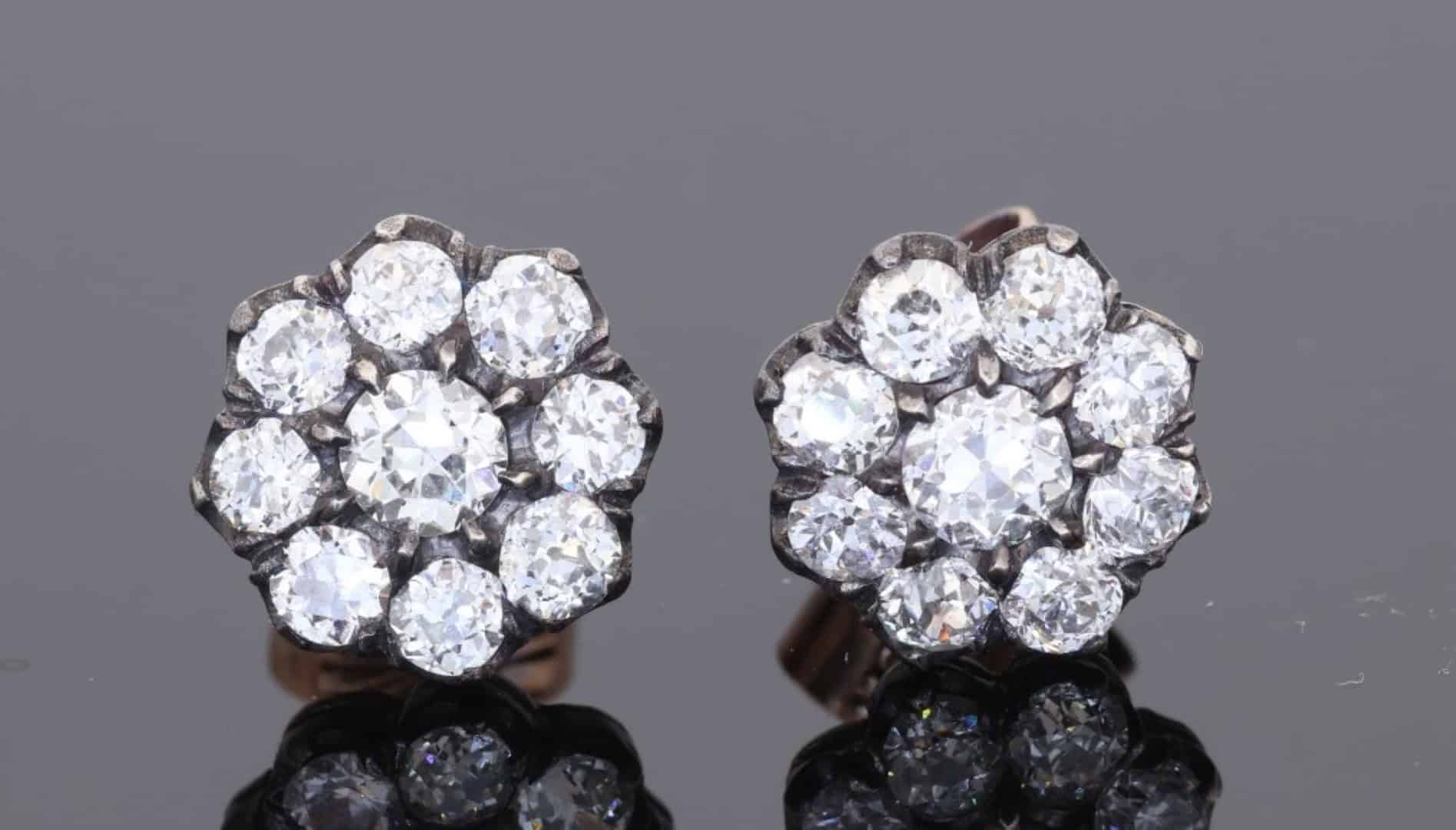 A superb pair of Victorian diamond cluster earrings, showcasing the opulent sparkle and intricate character associated with nineteenth-century jewellery. Together they contain approximately 3 carats of diamonds, creating a wonderfully substantial presence while retaining the elegant proportions of a classic Victorian cluster design.