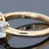 Pink sapphire and diamond three stone ring, side view