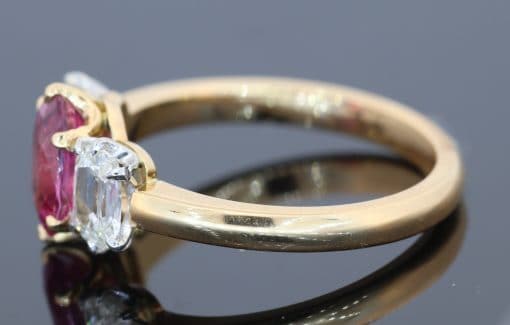 Pink sapphire and diamond three stone ring, side view