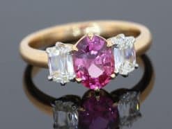Pink sapphire and diamond three stone ring
