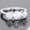 A timeless three-stone diamond ring, beautifully crafted in platinum and designed to celebrate the enduring allure of diamonds. With a substantial centre stone framed by two complementary diamonds, this elegant design offers a harmonious balance of brilliance, proportion and understated sophistication.