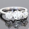 A timeless three-stone diamond ring, beautifully crafted in platinum and designed to celebrate the enduring allure of diamonds. With a substantial centre stone framed by two complementary diamonds, this elegant design offers a harmonious balance of brilliance, proportion and understated sophistication.