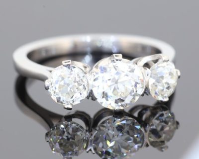 A timeless three-stone diamond ring, beautifully crafted in platinum and designed to celebrate the enduring allure of diamonds. With a substantial centre stone framed by two complementary diamonds, this elegant design offers a harmonious balance of brilliance, proportion and understated sophistication.